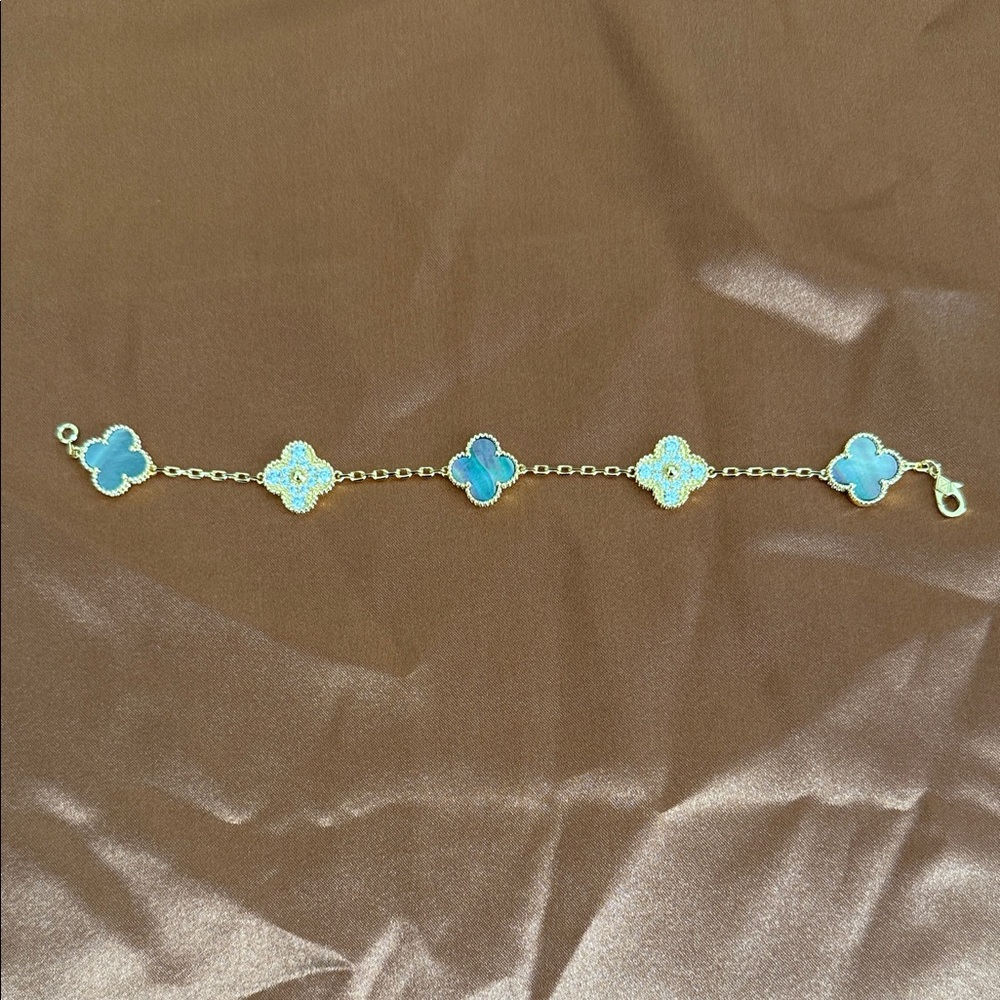 Elegant Gold and dark Mother of Pearl Clover Bracelet